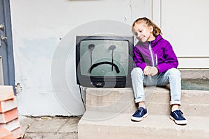 Little girl and vintage TV