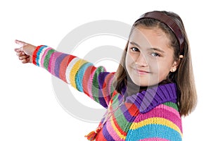 Adorable girl with woollen jacket pointing photo