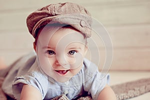 Adorable happy baby boy in a bright room