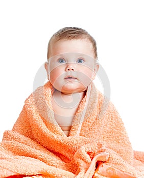 Adorable happy baby girl in towel