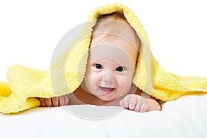 Adorable happy baby in towel