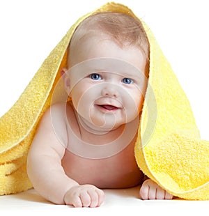 Adorable happy blue-eyed baby in yellow towel