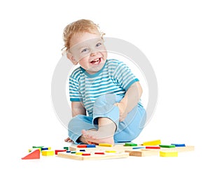 Adorable happy child playing educational toys