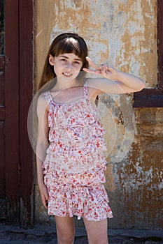 Adorable happy little girl outdoors. Portrait of caucasian kid enjoy summer