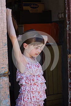 Adorable happy little girl outdoors. Portrait of caucasian kid enjoy summer