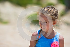 Adorable happy smiling little girl on beach