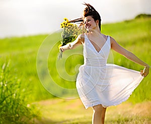 Adorable happy summer woman skipping