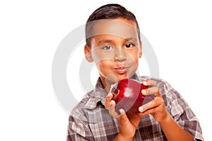 Adorable Hispanic Boy Eating a Large Red Apple