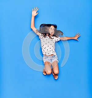 Adorable hispanic child girl wearing casual clothes smiling happy