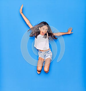 Adorable hispanic child girl wearing casual clothes smiling happy
