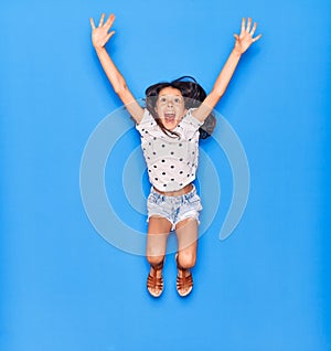 Adorable hispanic child girl wearing casual clothes smiling happy