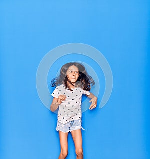 Adorable hispanic child girl wearing casual clothes smiling happy