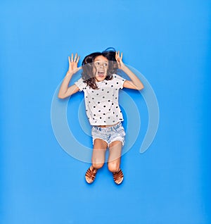 Adorable hispanic child girl wearing casual clothes smiling happy