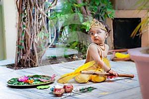 adorable infant dressed as hindu god krishna cute facial expression with flute at janmashtami