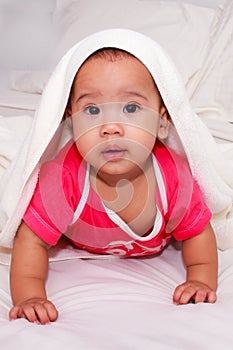 Adorable infant with towel on her head