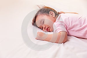 Adorable innocent baby girl sleeping on bed with good dream. Cute mixed race infant baby get deep sleep and peaceful. Lovely