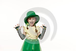 Adorable Irish little girl in Leprechaun carnival costume, expressing amazement looking at camera, on white background