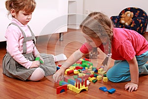 Adorable kids playing with blocks