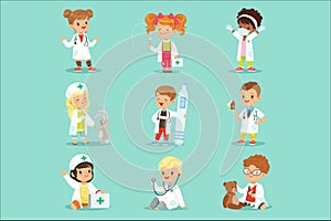 Adorable kids playing doctor set. Smiling little boys and girls dressed as doctors playing with toy medical equipment