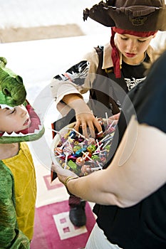 Adorable kids playing trick or treat