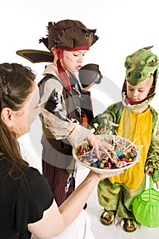 Adorable kids playing trick or treat