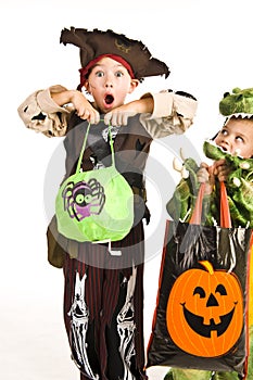 Adorable kids playing trick or treat photo