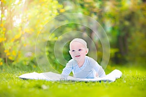 Adorable laughing baby in the garden