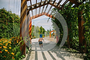 Adorable little 1-2 year old toddler boy having fun on playground in Krakow, Poland