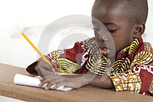 Adorable Little African Child Writing at School in Bamako, Mali