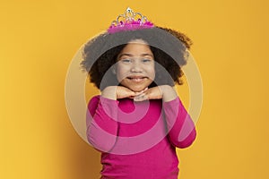 Adorable Little Afro Girl Wearing Princess Crown And Smiling At Camera