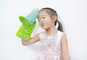 Adorable little Asian child girl hand wear and playing Crocodile puppets on white background