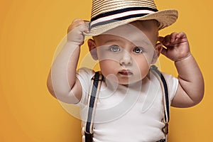 Adorable little baby boy posing.