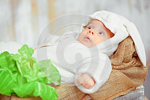 Adorable little baby in a funny bunny bodysuit