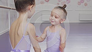 Adorable little ballerinas having fun at ballet school