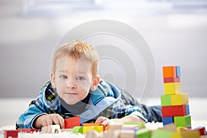 Adorable little boy playing at home
