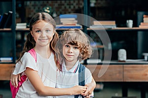 adorable little brother and sister embracing