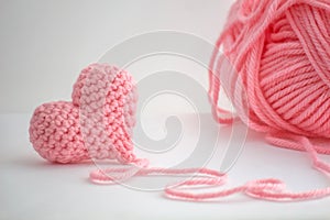 Adorable little crocheted heart and a skein of yarn