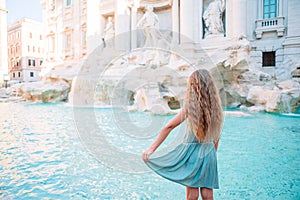 Adorable little girl background Trevi Fountain, Rome, Italy.