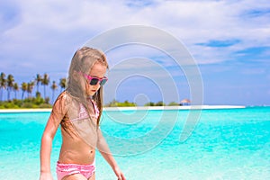 Adorable little girl at beach during summer