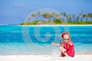 Adorable little girl at beach during summer