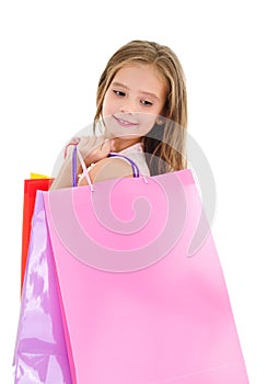 Adorable little girl child holding shopping colorful paper bags