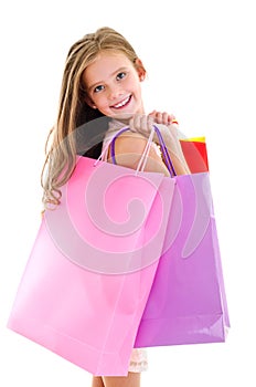 Adorable little girl child holding shopping colorful paper bags