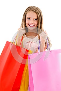 Adorable little girl child holding shopping colorful paper bags