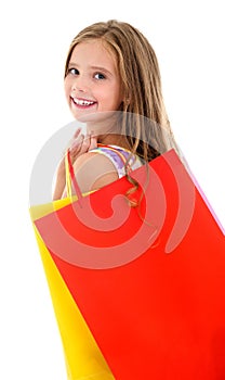 Adorable little girl child holding shopping colorful paper bags