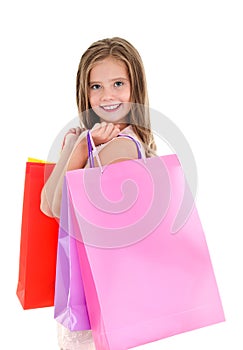 Adorable little girl child holding shopping colorful paper bags