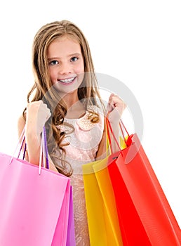 Adorable little girl child holding shopping colorful paper bags