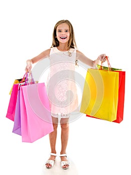 Adorable little girl child holding shopping colorful paper bags