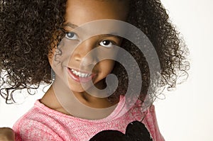 Adorable little girl with curly hair