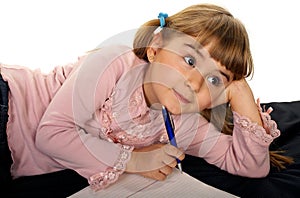 Adorable little girl doing homework
