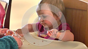 Adorable little girl eats spaghetti by herself for the first time, 4K